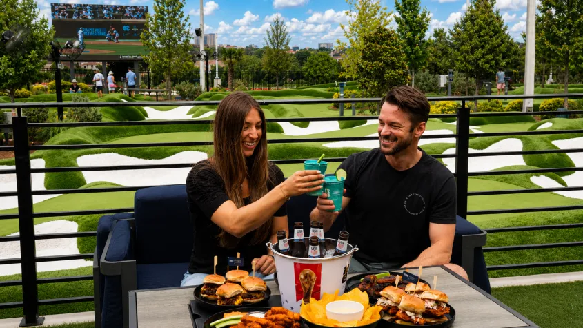 Couple enjoying drinks at PopStroke