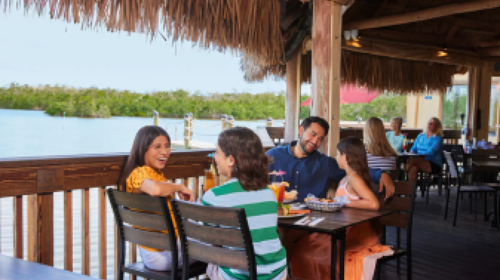 Family enjoying waterfront dining