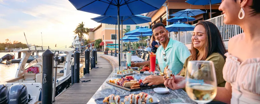 Friends enjoy dining on the waterfront in Cape Coral