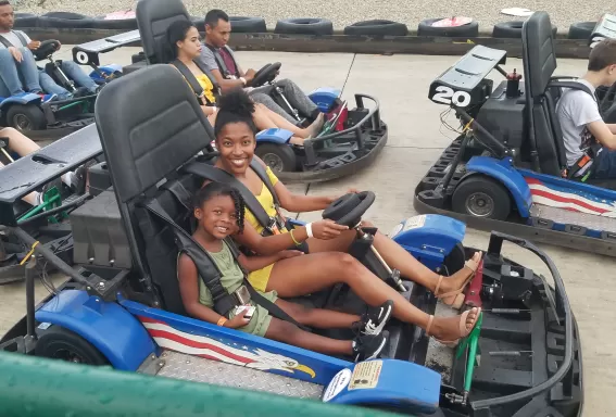 Group playing on go karts