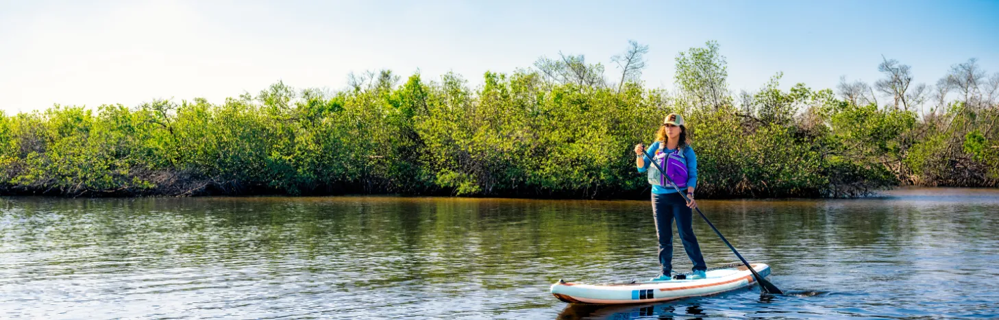 Diana paddle boarding near the mangroves in Cape Coral